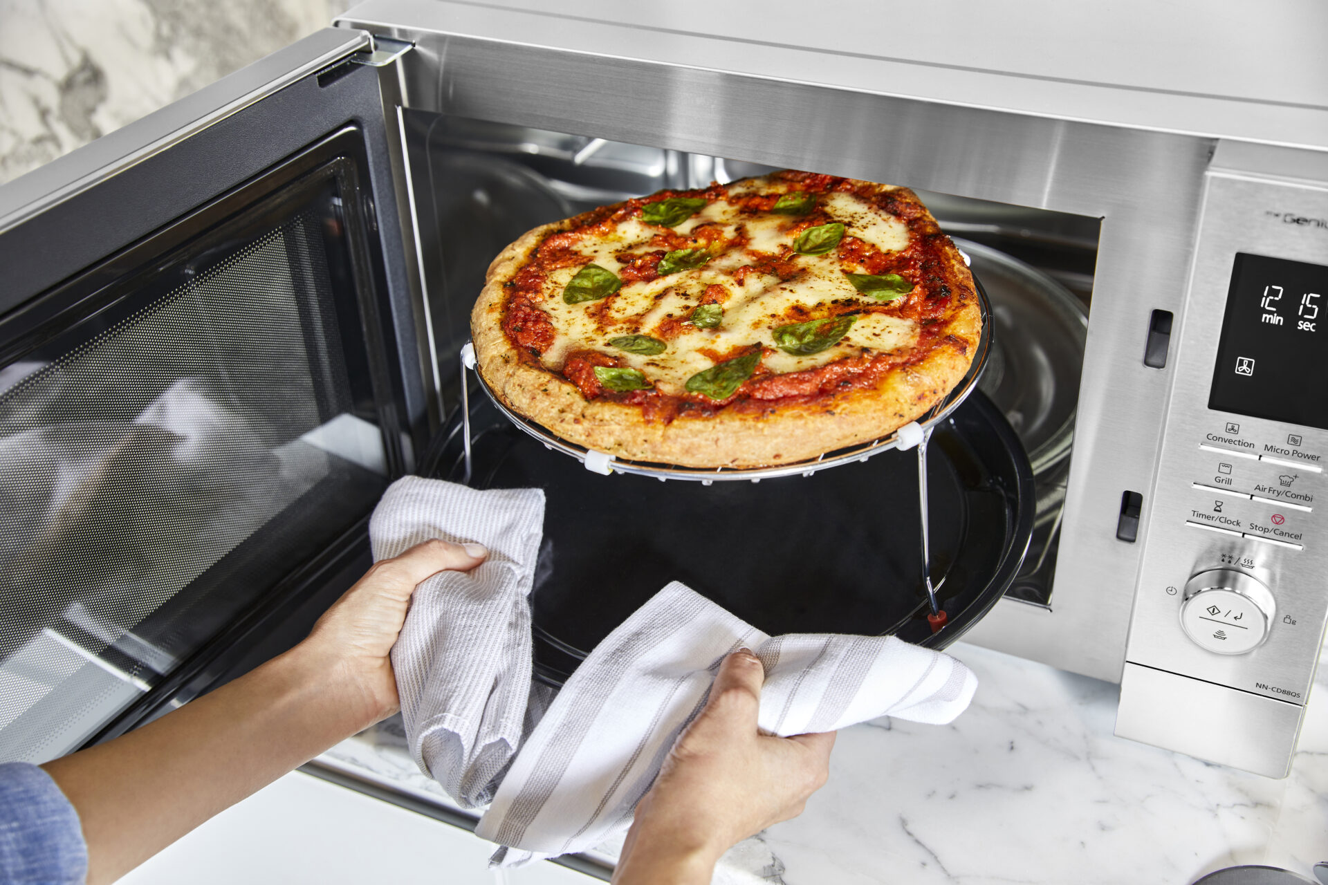 Panasonic NN-CD88QSEPG Panasonic MWO NN CD88 lifestyle image 2024 pizza unlimited rights